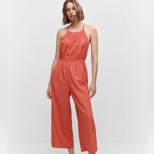 Mango open back jumpsuit with halter neck crochet details
